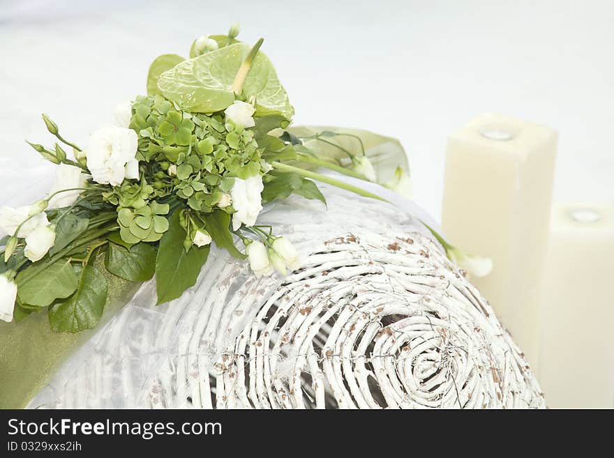 Wedding decoration. Green plants on a white basket