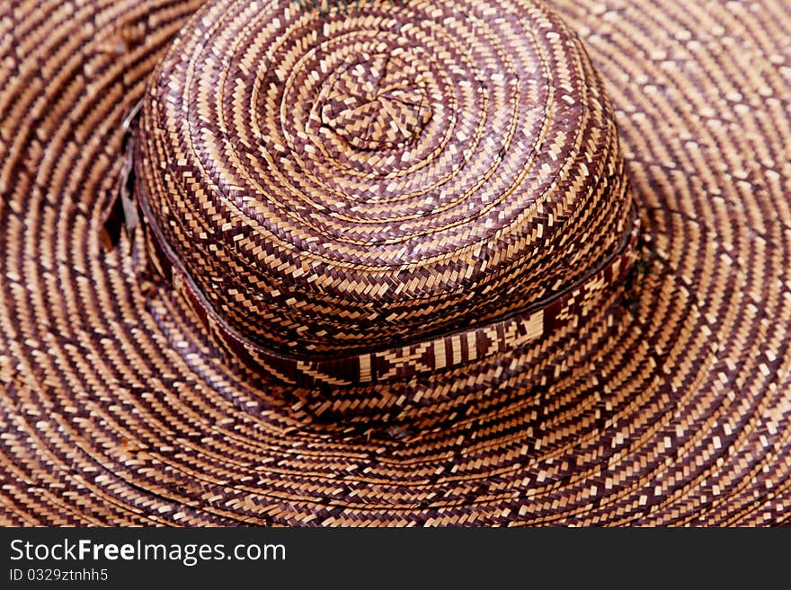 Brown and beige straw hat. Close up background