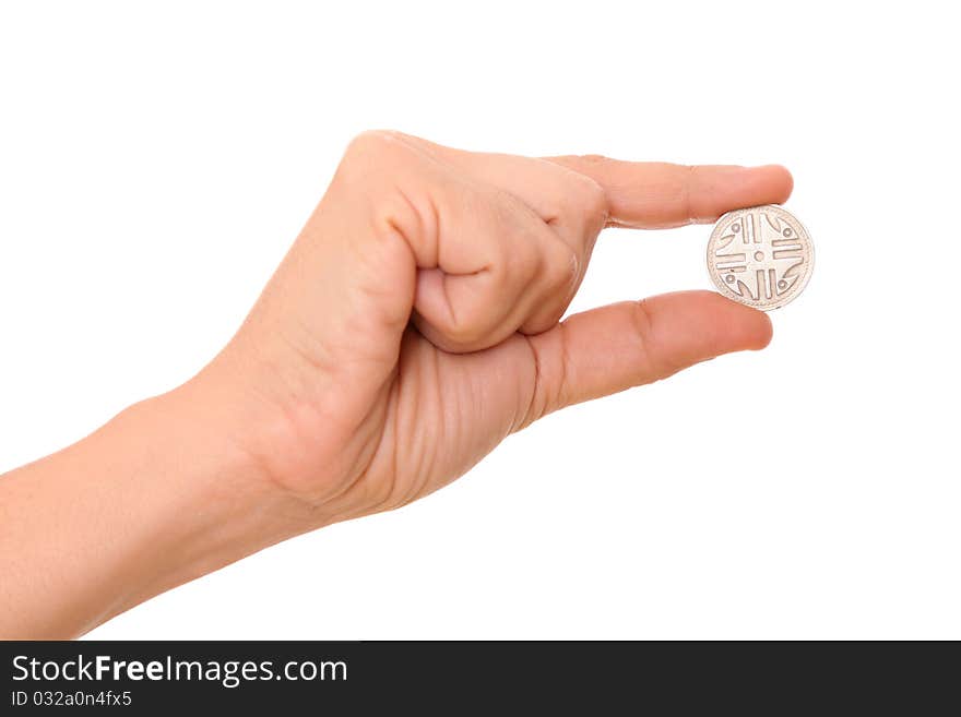 Hand holding a coin over white background