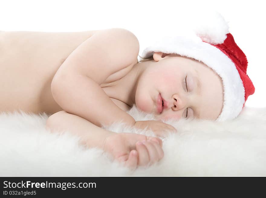 Baby in christmas suit is sleeping