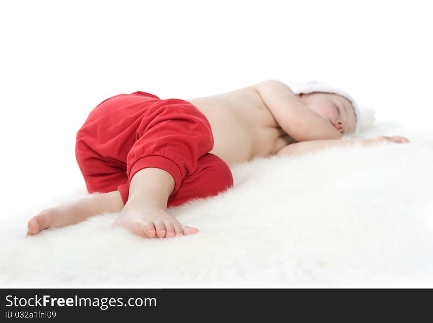 Baby in christmas suit is sleeping