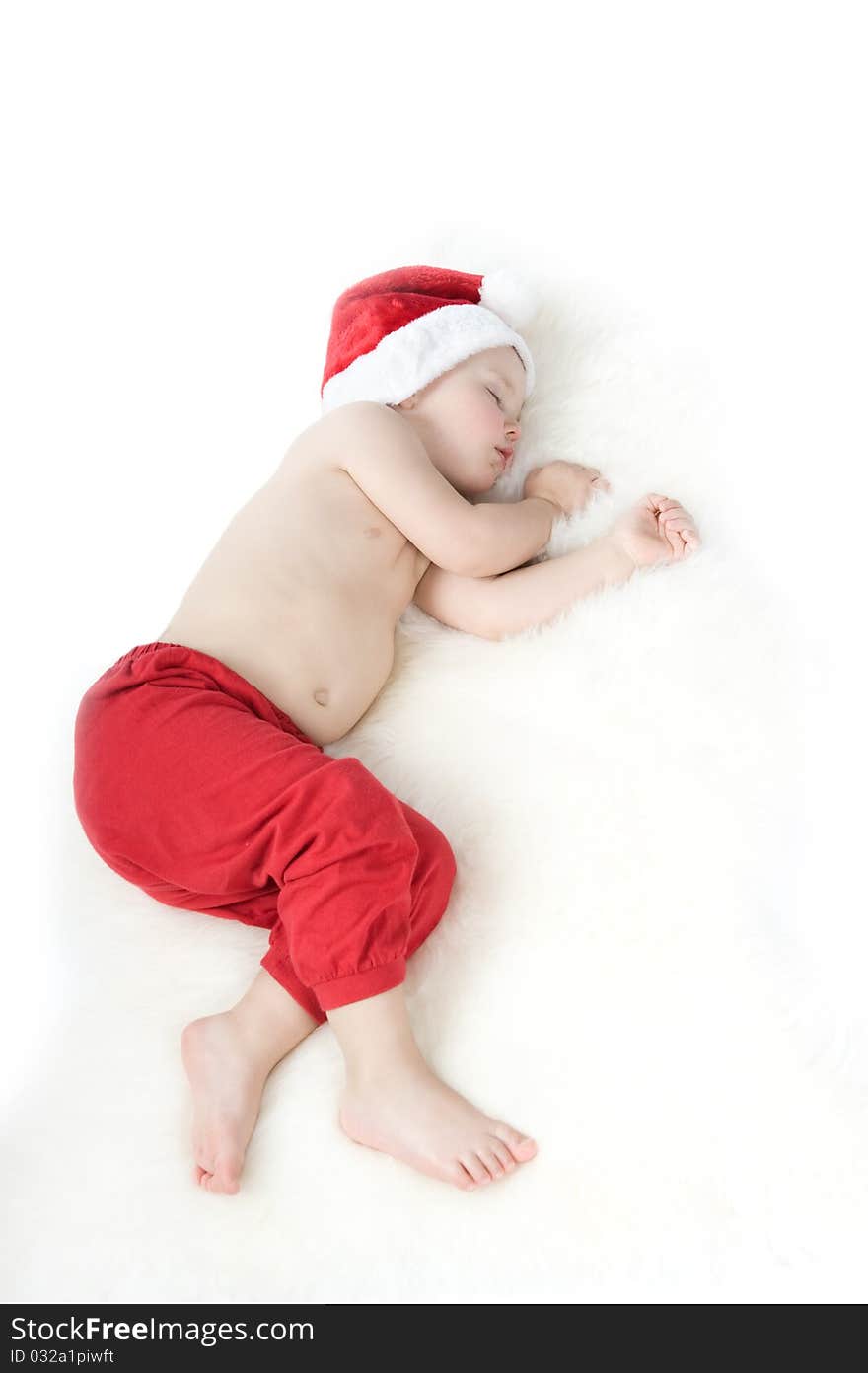 Baby in christmas suit is sleeping