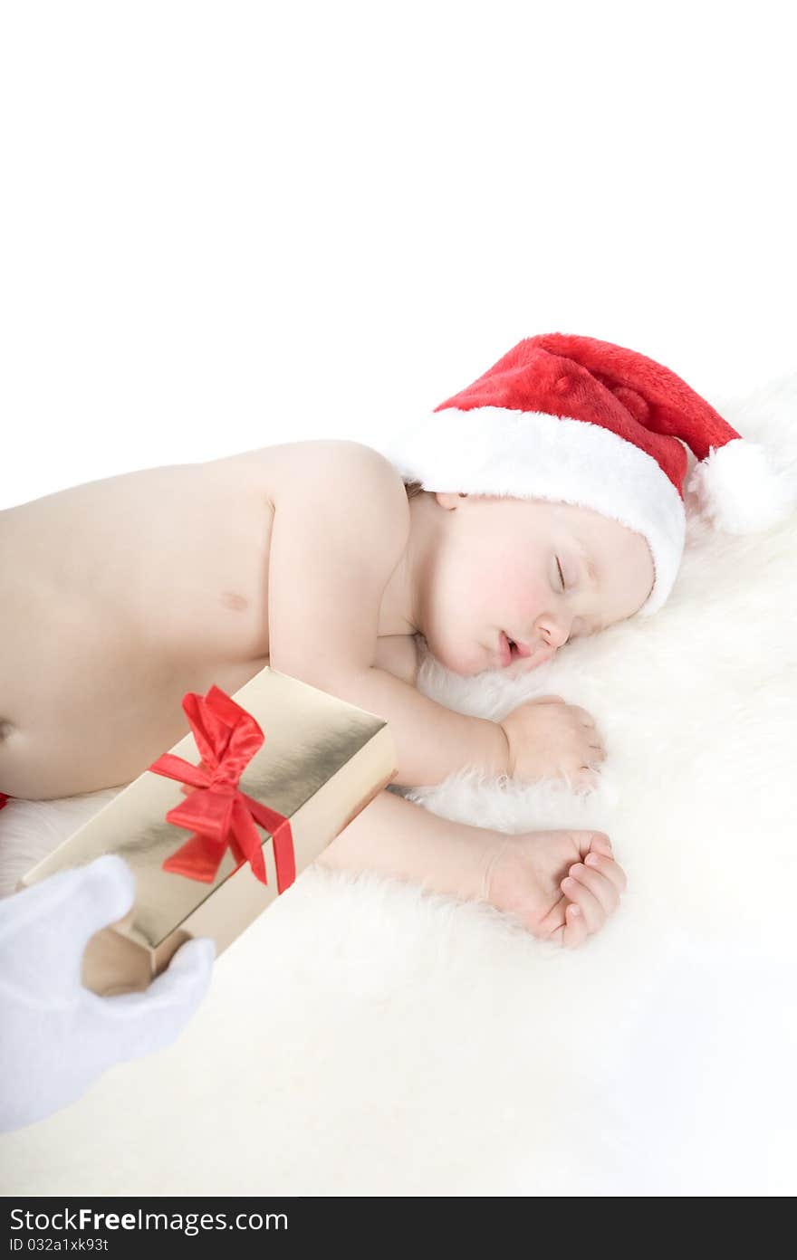 Baby in christmas suit is sleeping