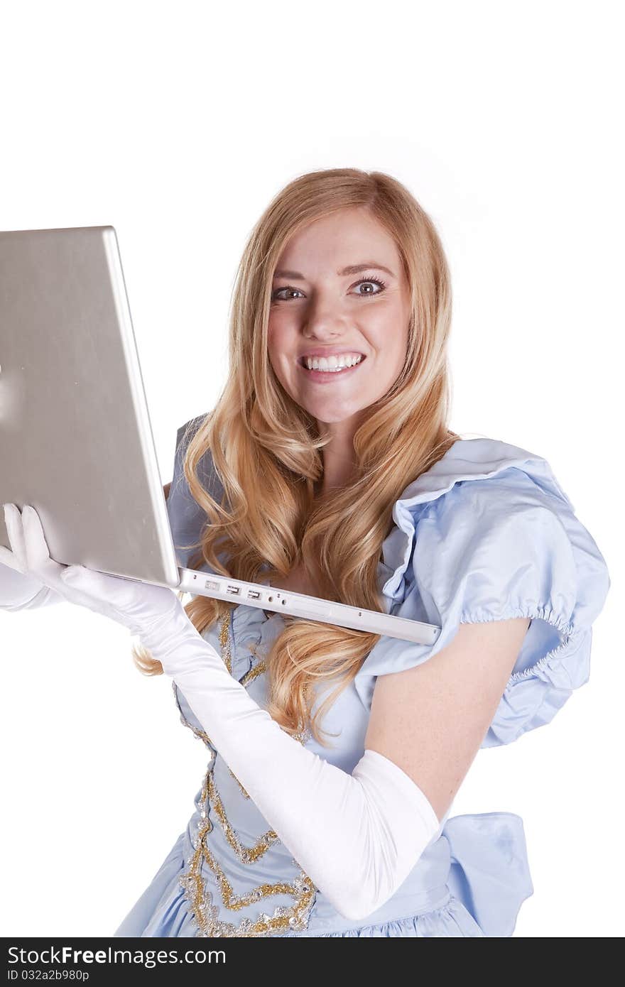 A woman in her princess dress holding and looking for her prince charming on the internet. she has a big smile on her face. A woman in her princess dress holding and looking for her prince charming on the internet. she has a big smile on her face.