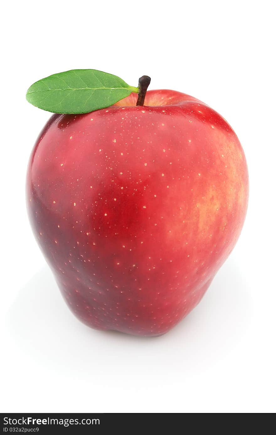 Fresh red apple with leaves