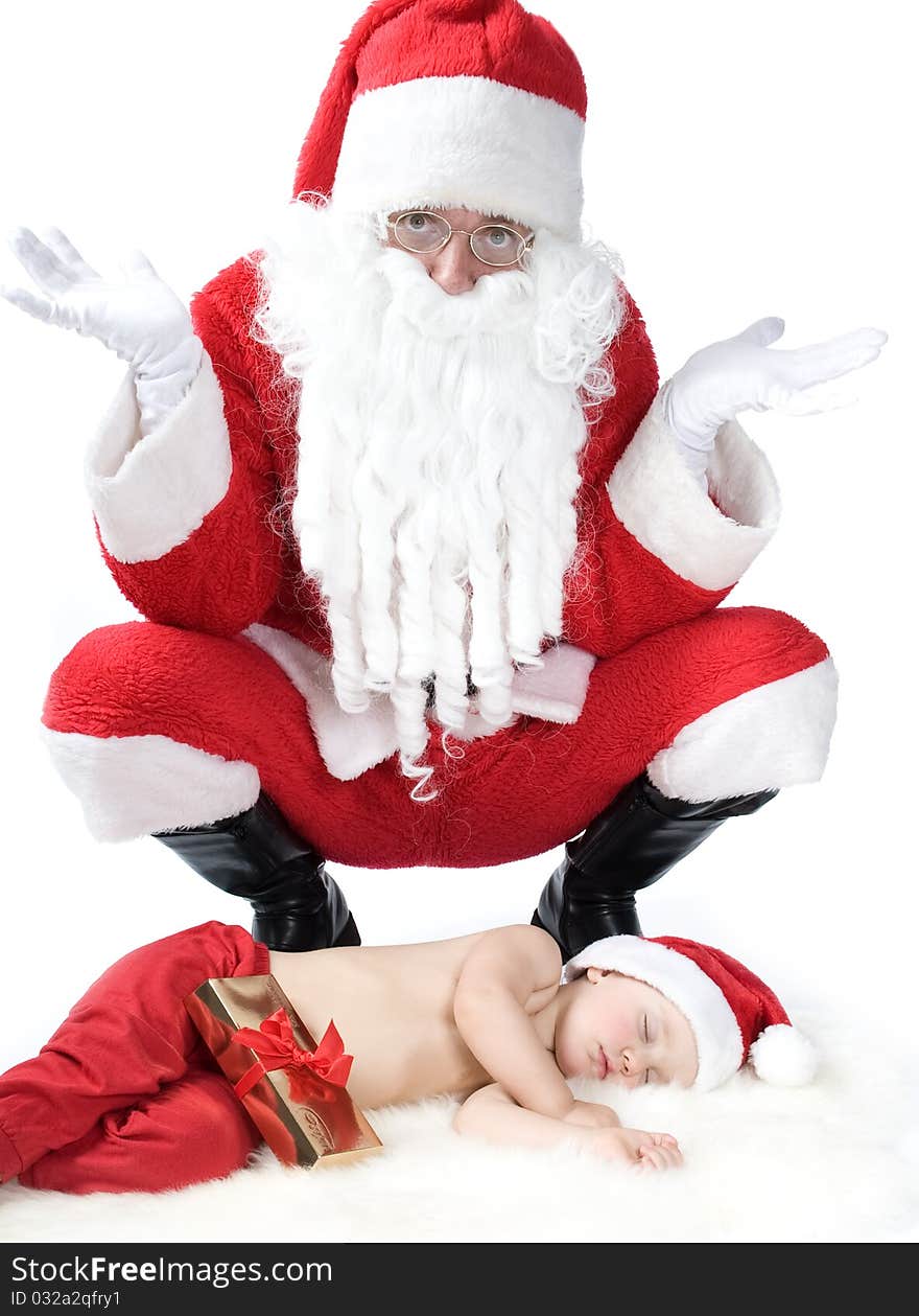 Santa is giving gift to sleeping baby