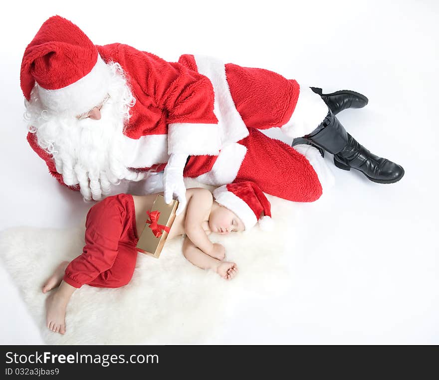 Santa Is Giving Gift To Sleeping Baby