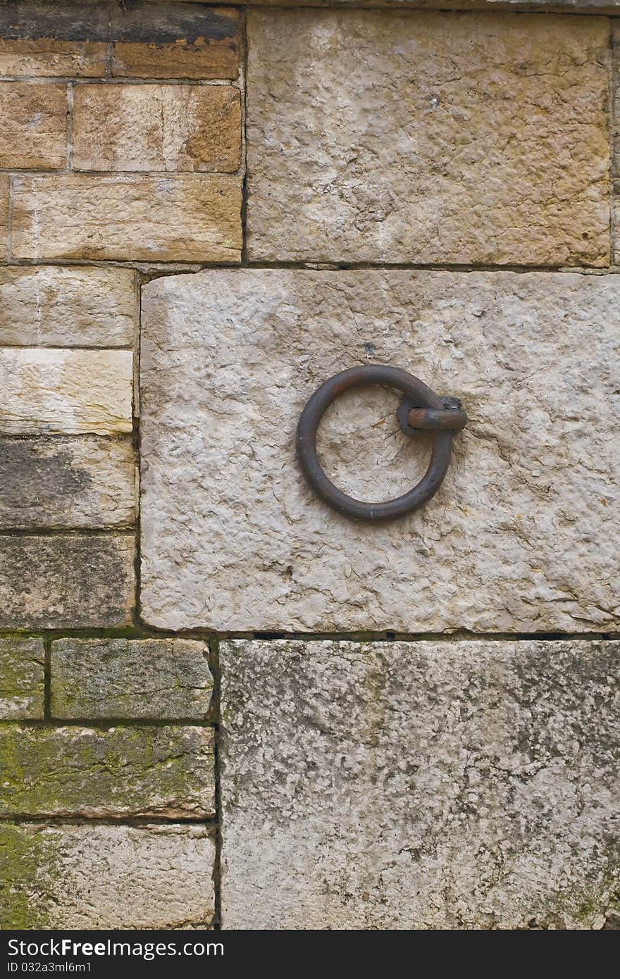 Mooring ring on stone embankment of river