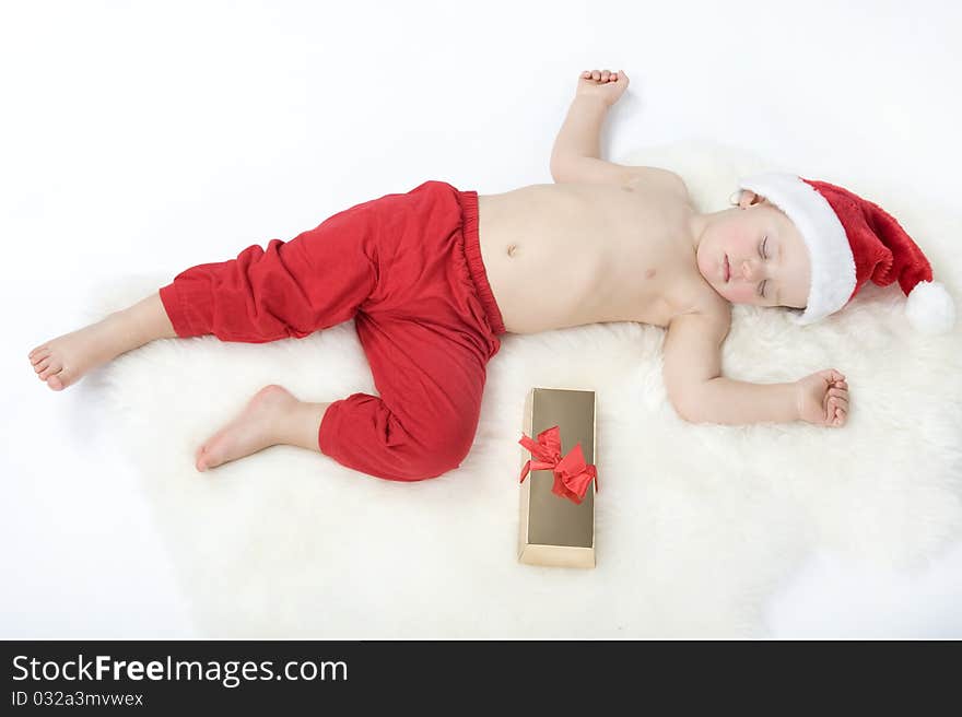 Baby In Christmas Suit Is Sleeping