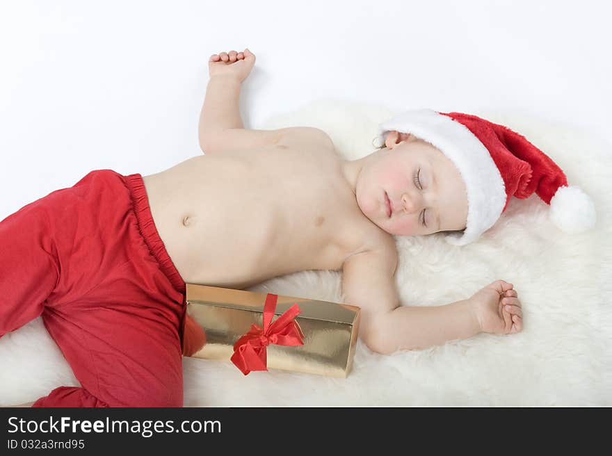 Baby in christmas suit is sleeping