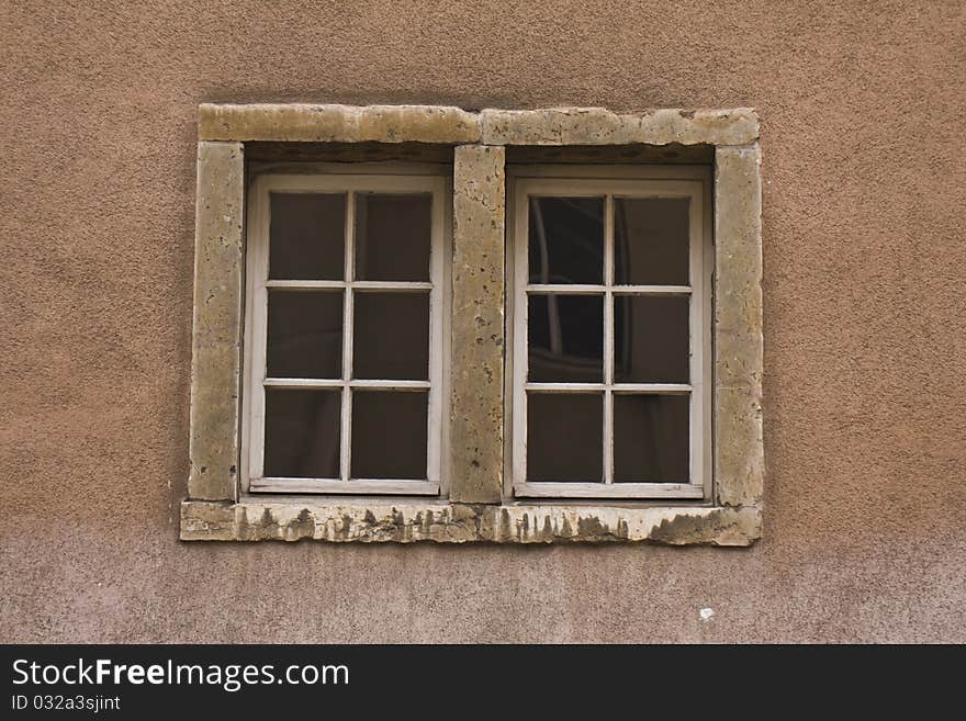 Old double window on wall