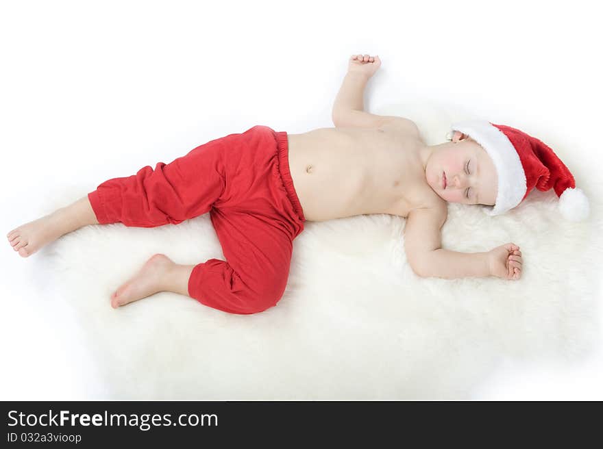 Baby in christmas suit is sleeping