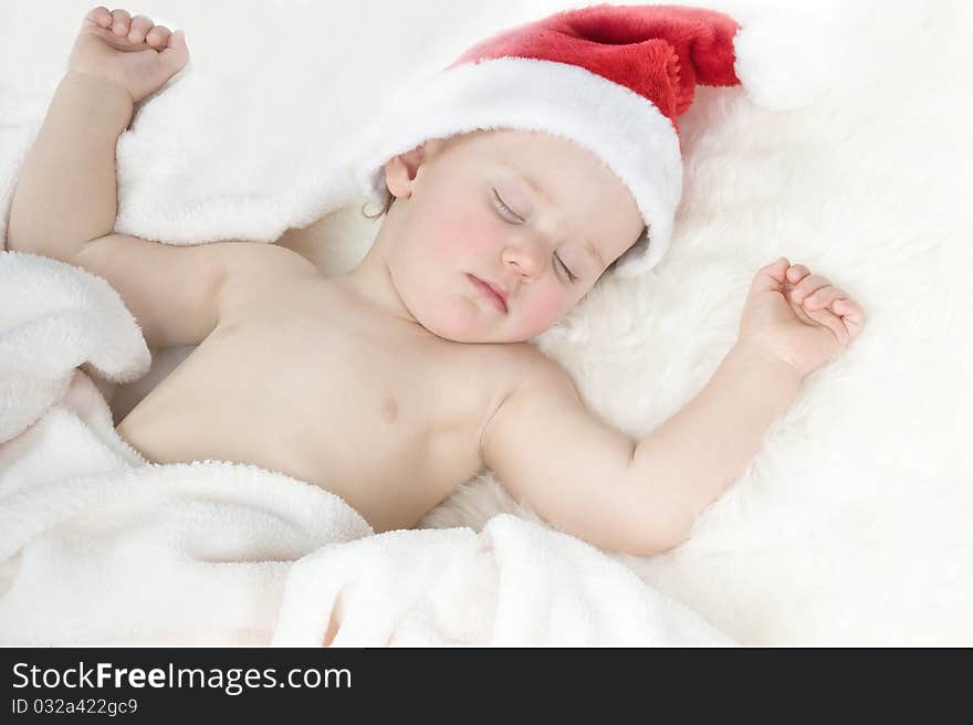 Baby in christmas suit is sleeping