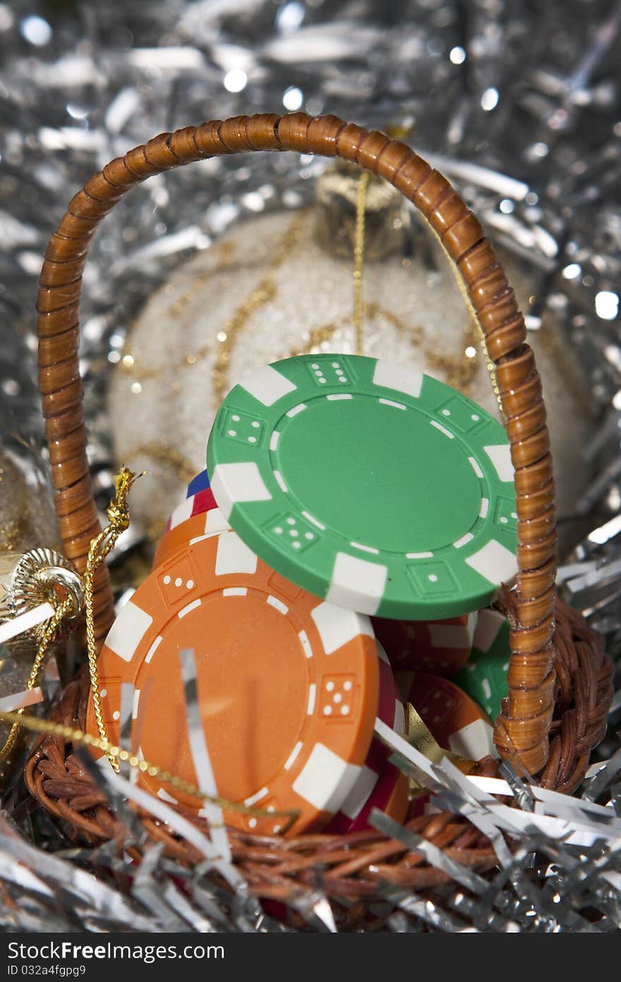 Casino chips bonus in a Christmas basket, photo taken in a worm Christmas light