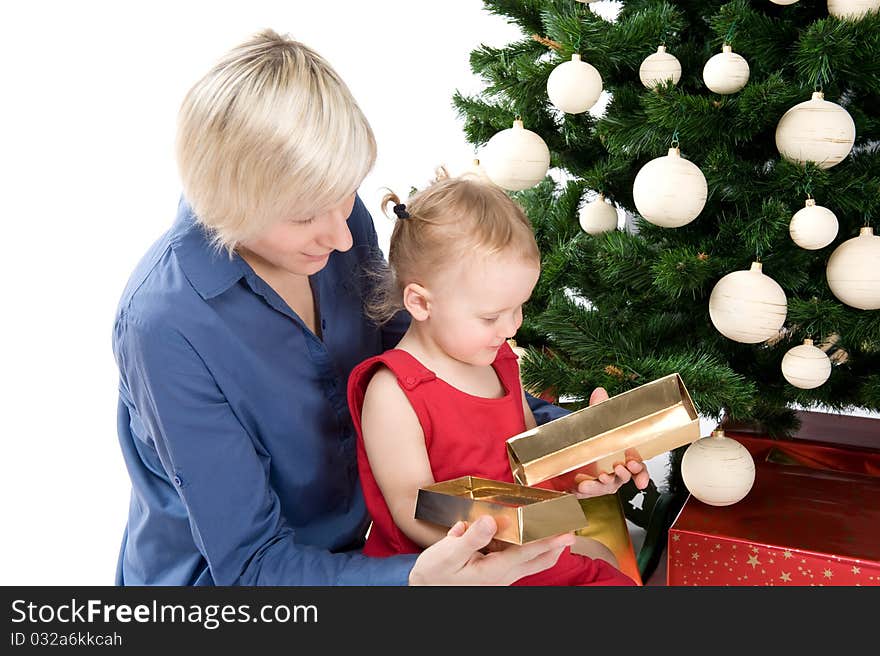 Mother is giving a gold gift to little baby