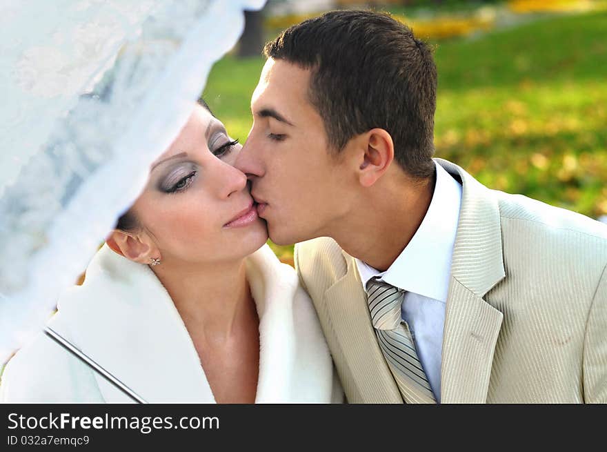 Groom kissing bride