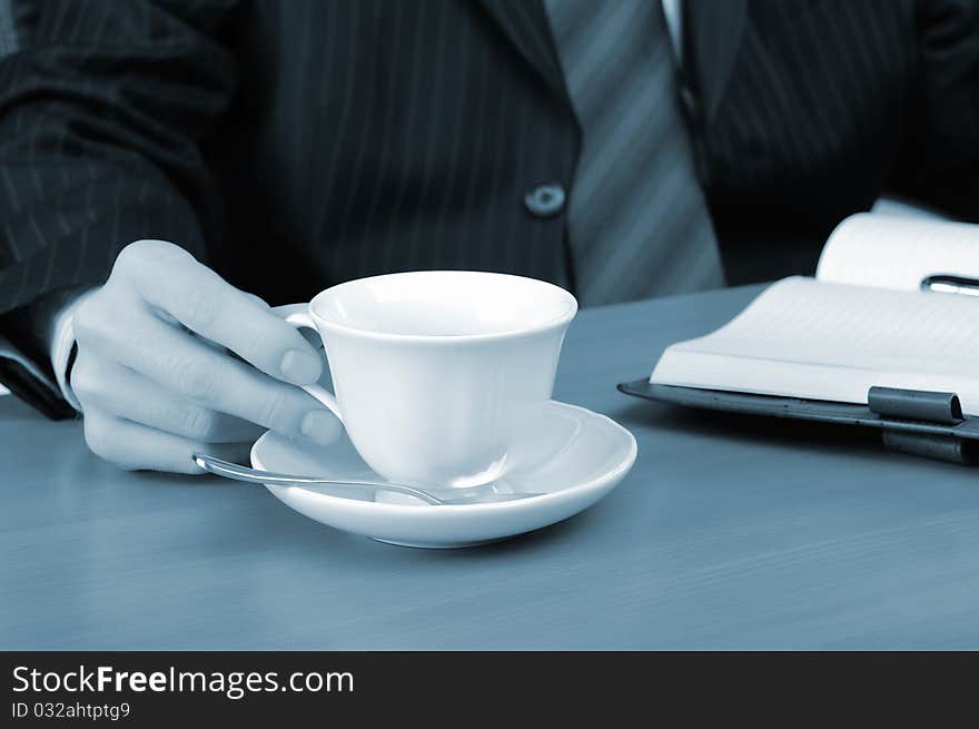 A young business man working in an office at his workplace.