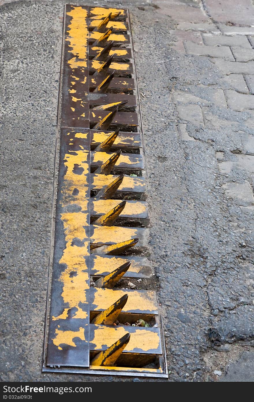 Road spike strip on street. Road spike strip on street