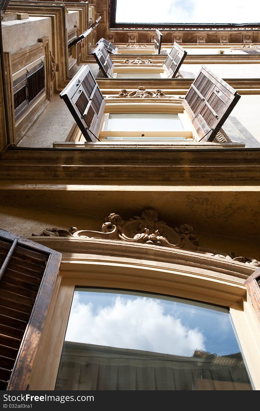 Four windows with open shutters