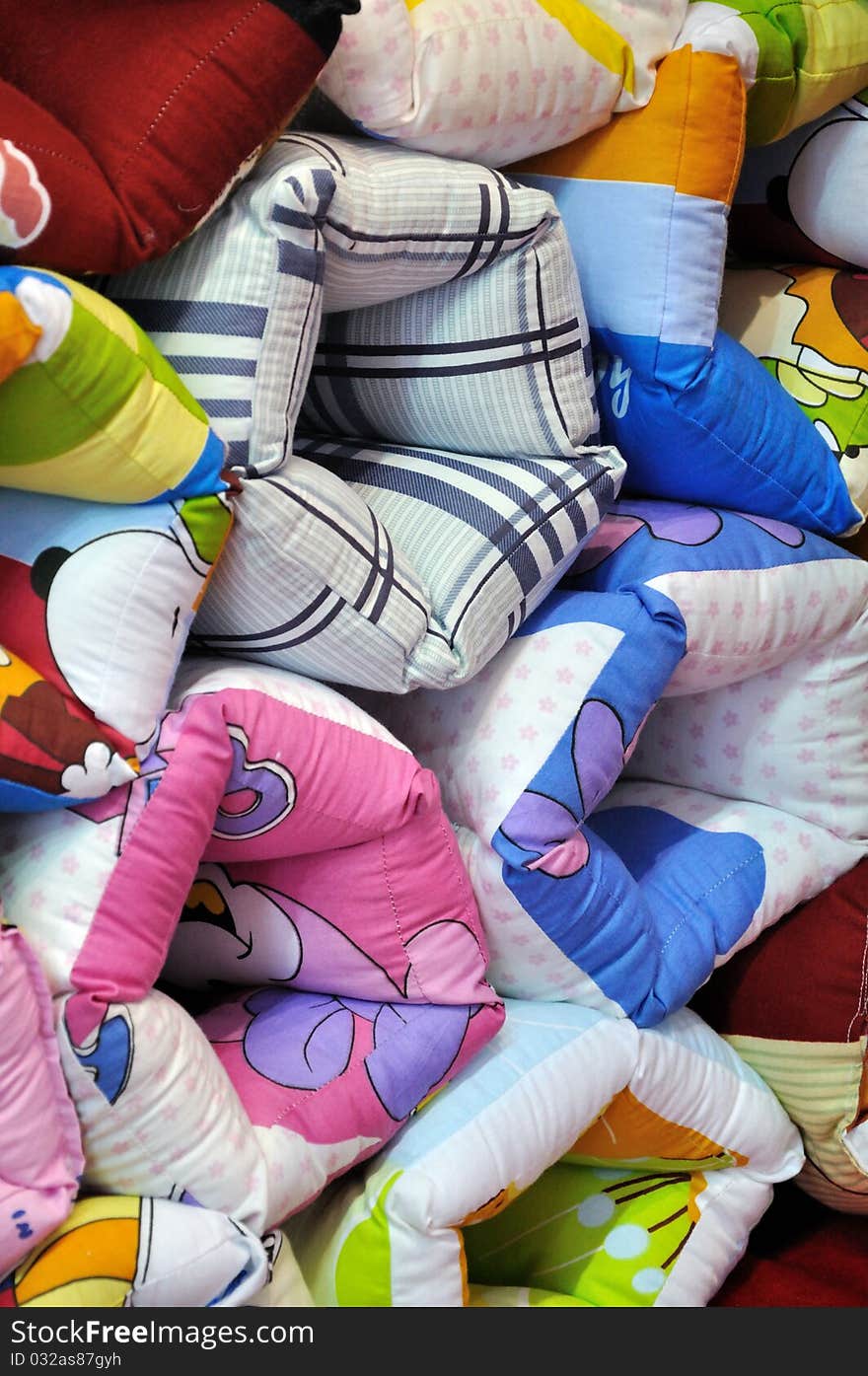 Colorful cloth pillow in stack, means home using appliance, colors and shape. Colorful cloth pillow in stack, means home using appliance, colors and shape.