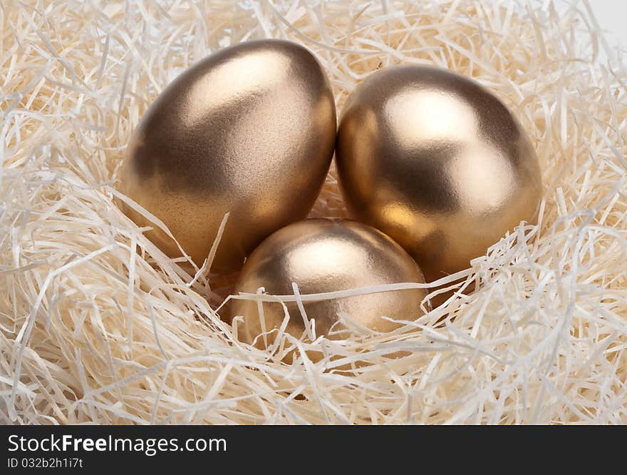 Three golden eggs in the  nest