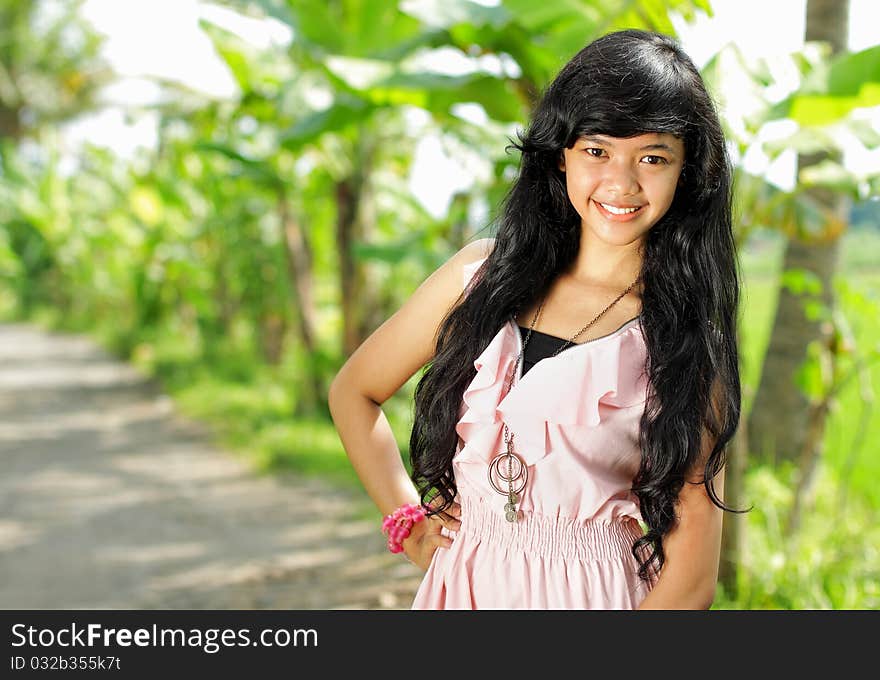 Beautiful teenage girl smiling in green nature. Beautiful teenage girl smiling in green nature