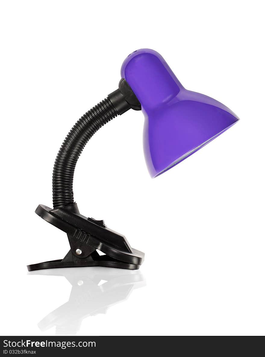 Flexible purple desklamp bent downwards. Flexible purple desklamp bent downwards