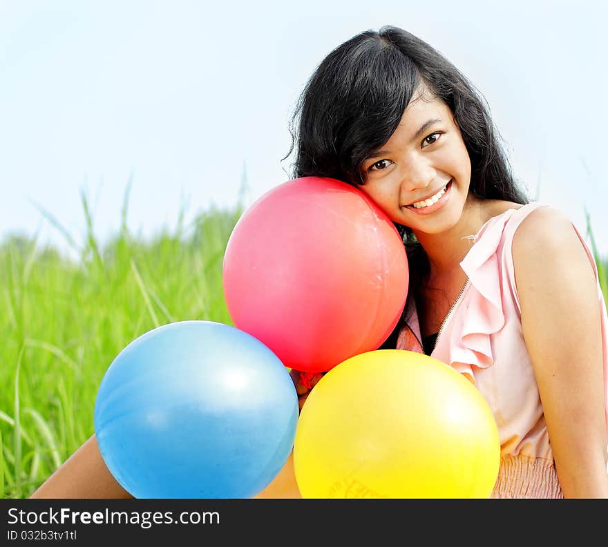 Smiling Teenage girl with colorful balloons. Smiling Teenage girl with colorful balloons