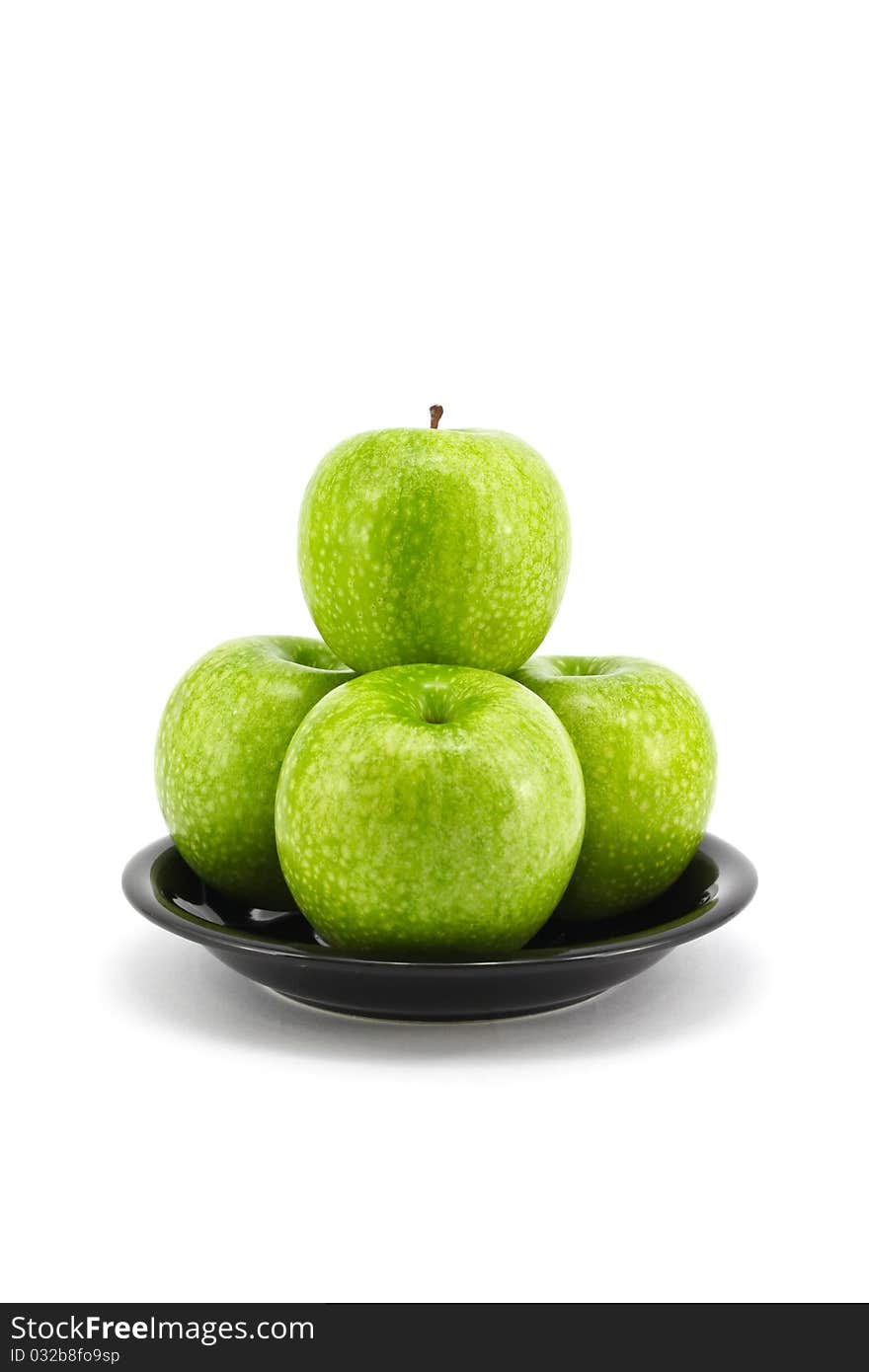 Fresh green apple on plate isolated on white background. Fresh green apple on plate isolated on white background