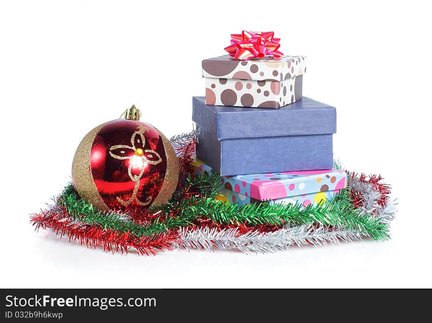 A pile Christmas ball and gifts isolated on white background. A pile Christmas ball and gifts isolated on white background.