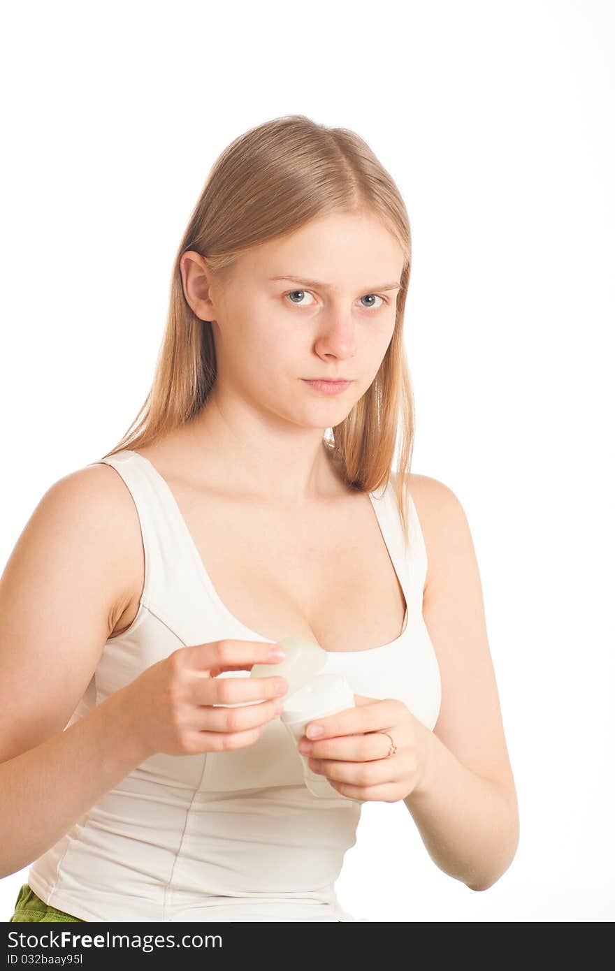 Young woman closing deodorant