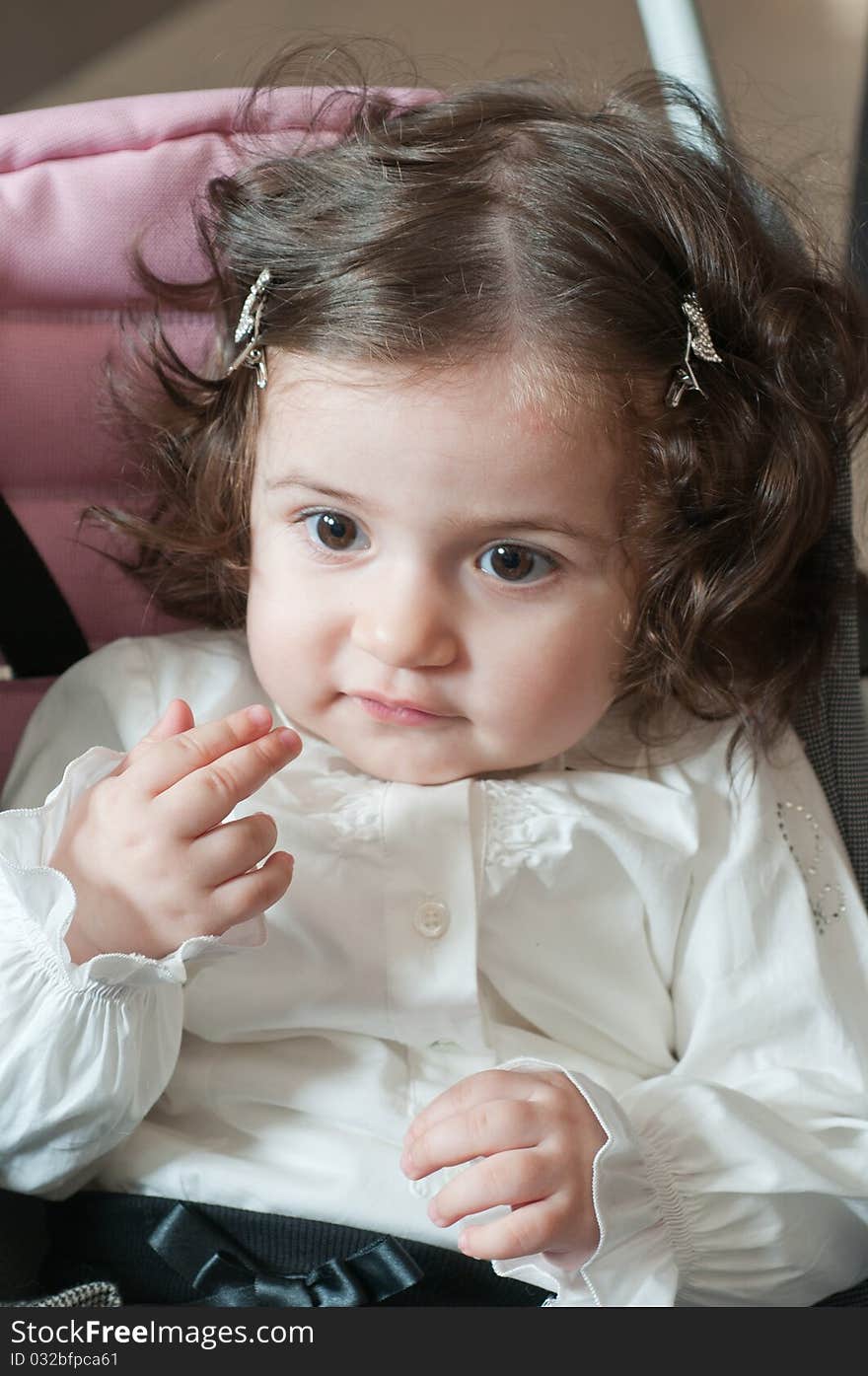 The little girl with the big expressive eyes and wavy hair. The little girl with the big expressive eyes and wavy hair.