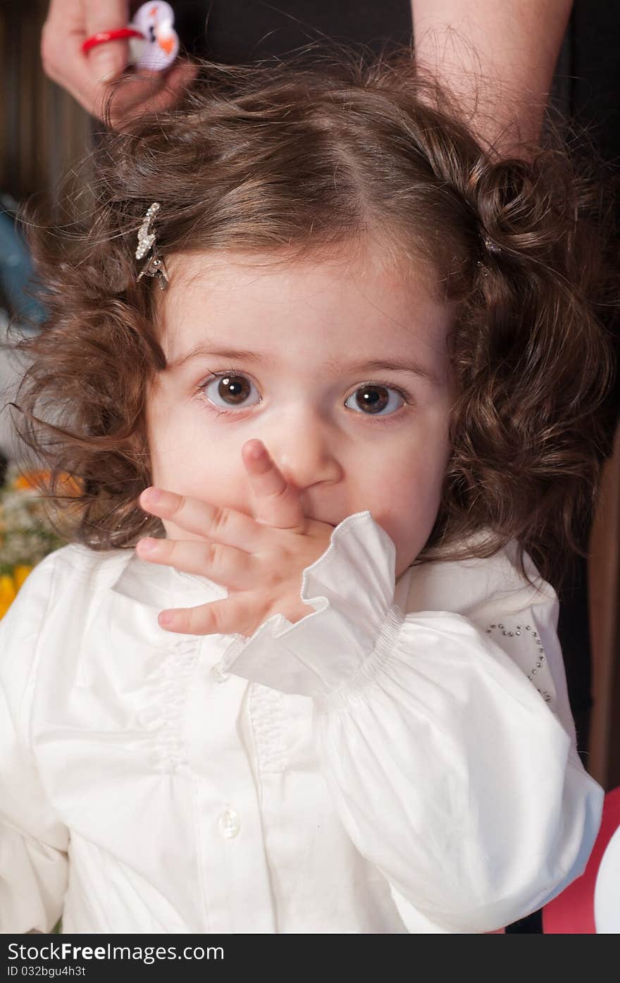 The little girl with the big expressive eyes and wavy hair. The little girl with the big expressive eyes and wavy hair.