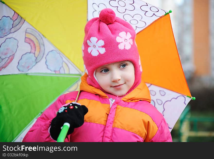 Adorable small girl in colorful clothers