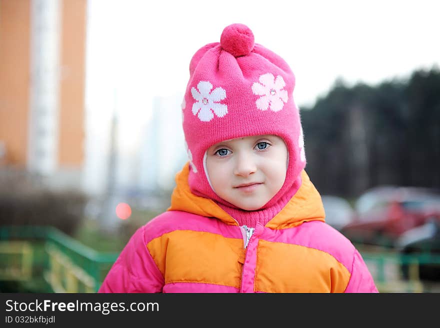 Portrait of small girl in warm pink hat. Portrait of small girl in warm pink hat