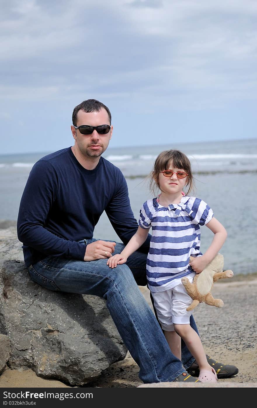 Father and daughter near the ocen