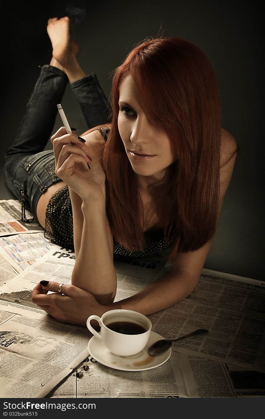 Beautiful young woman smoking cigarette. Beautiful young woman smoking cigarette