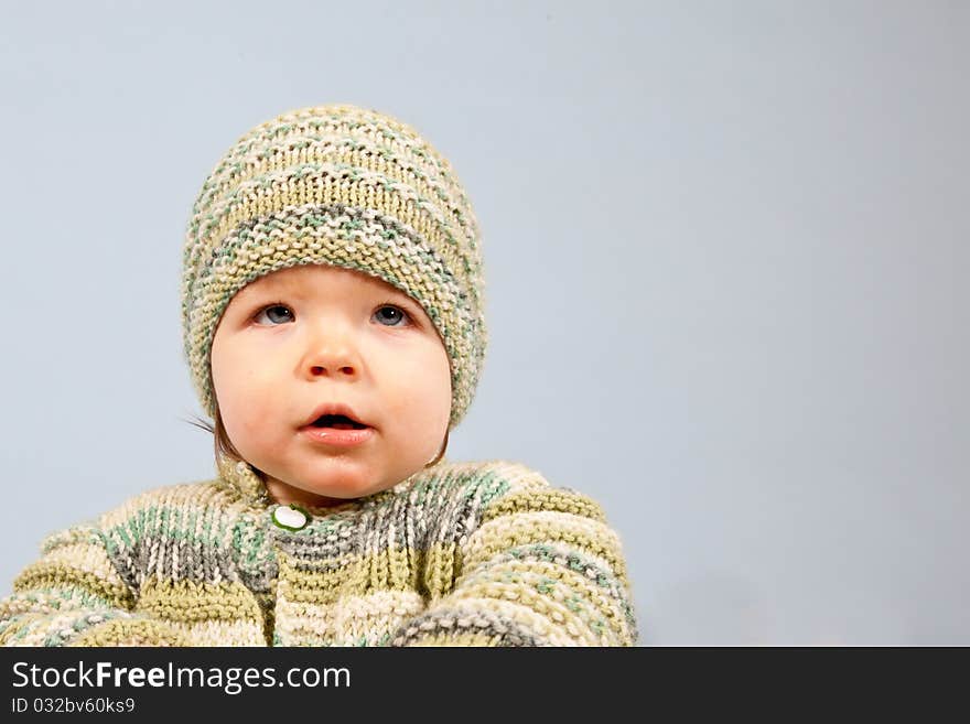 A young Boy who is Day-Dreaming in Studio, isolated on blue Background. A young Boy who is Day-Dreaming in Studio, isolated on blue Background.