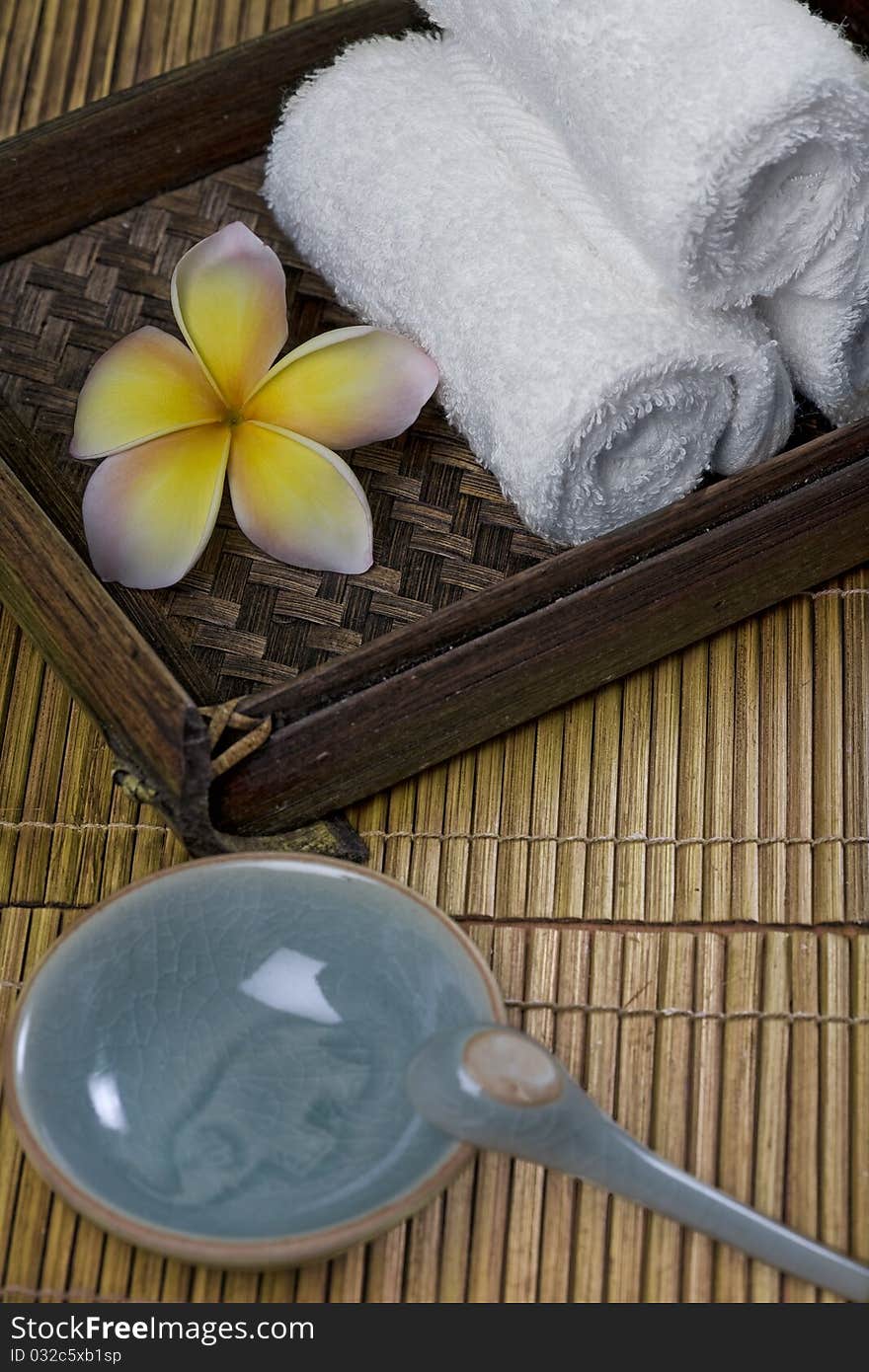 Close up view of stones  and flower  on color back. Close up view of stones  and flower  on color back