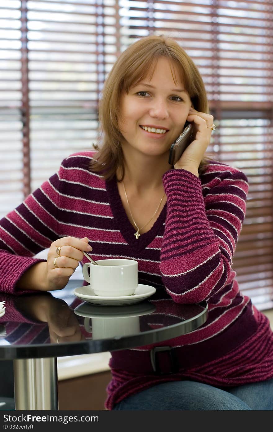 The girl talks by a mobile phone