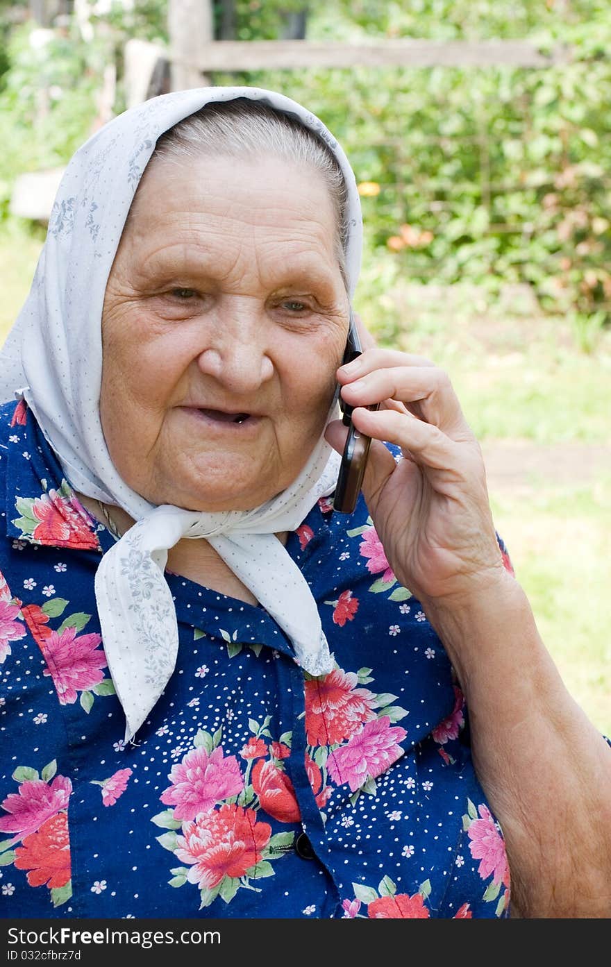 Grandmother Talking With A Phone