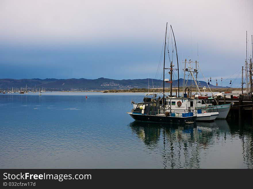 Fishing boats harbored in Morro Bay, California. Fishing boats harbored in Morro Bay, California.