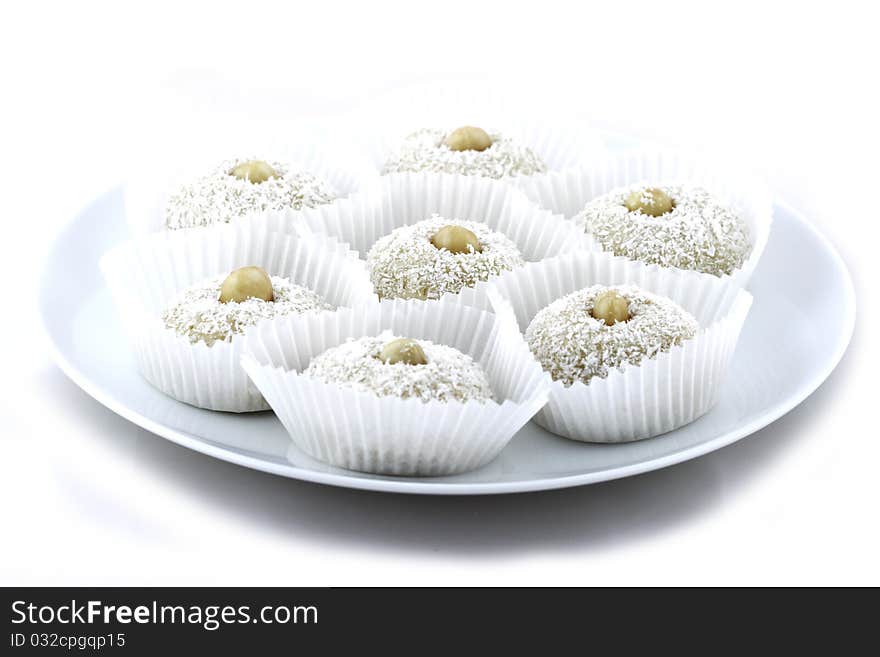 Coconut short cake with almonds on white background. Coconut short cake with almonds on white background