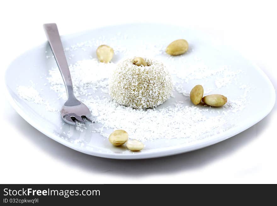 Coconut short cake with almonds on white background. Coconut short cake with almonds on white background