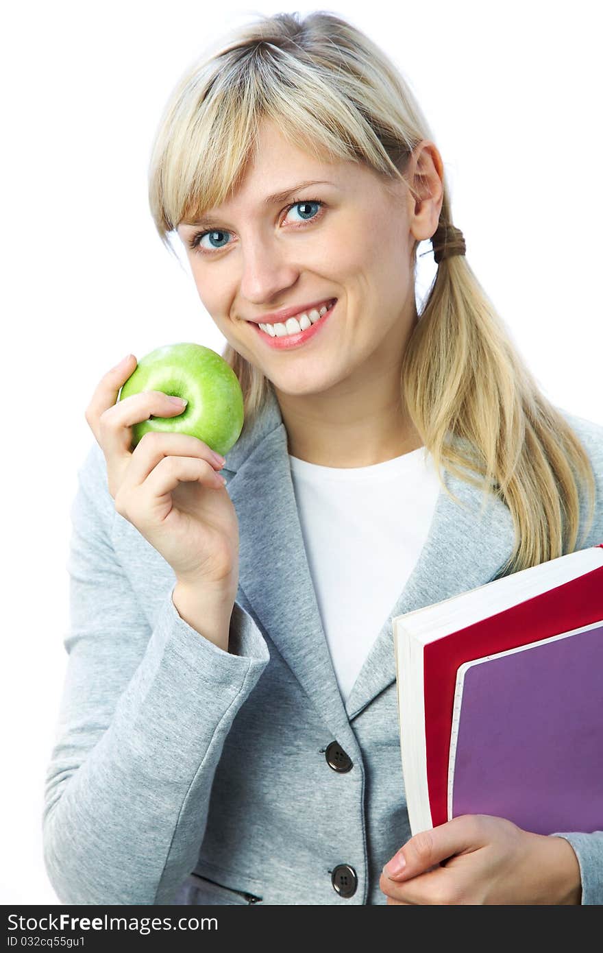 Portrait of blonde girl student with books and apple on the white background. Portrait of blonde girl student with books and apple on the white background