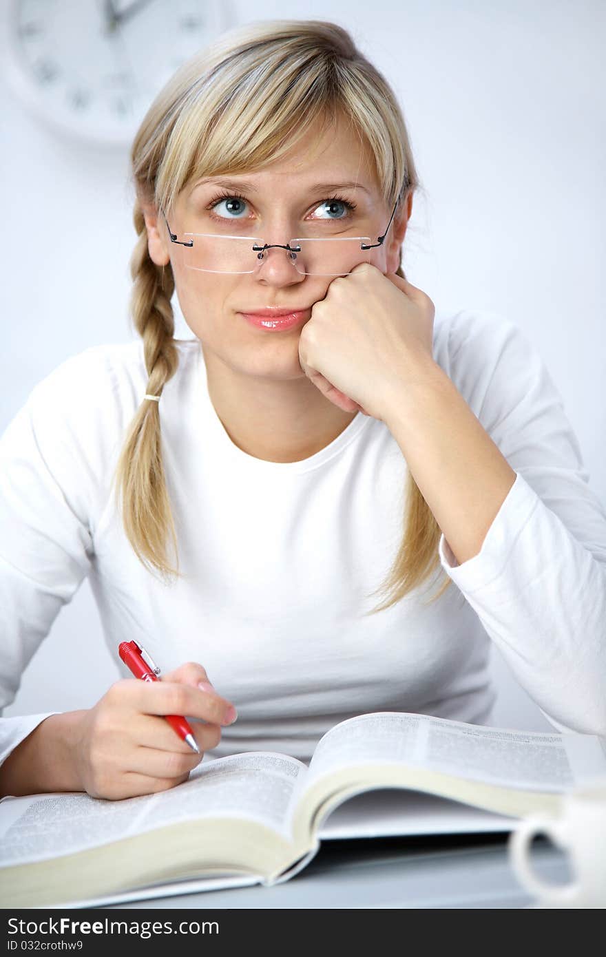 Portrait of Intelligence girl student reading  book in classroom