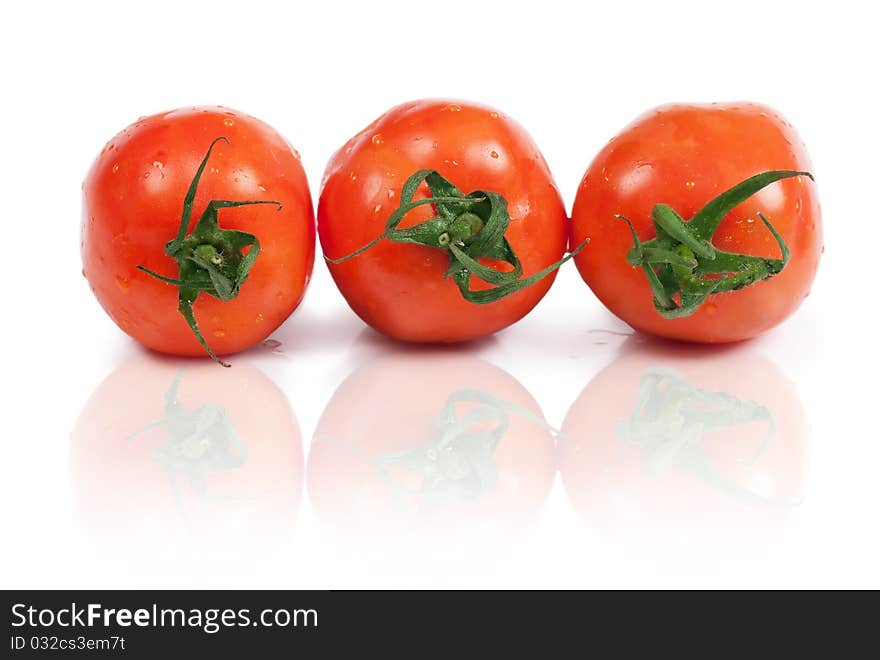 Closeup view of three tomatoes isolated on the white