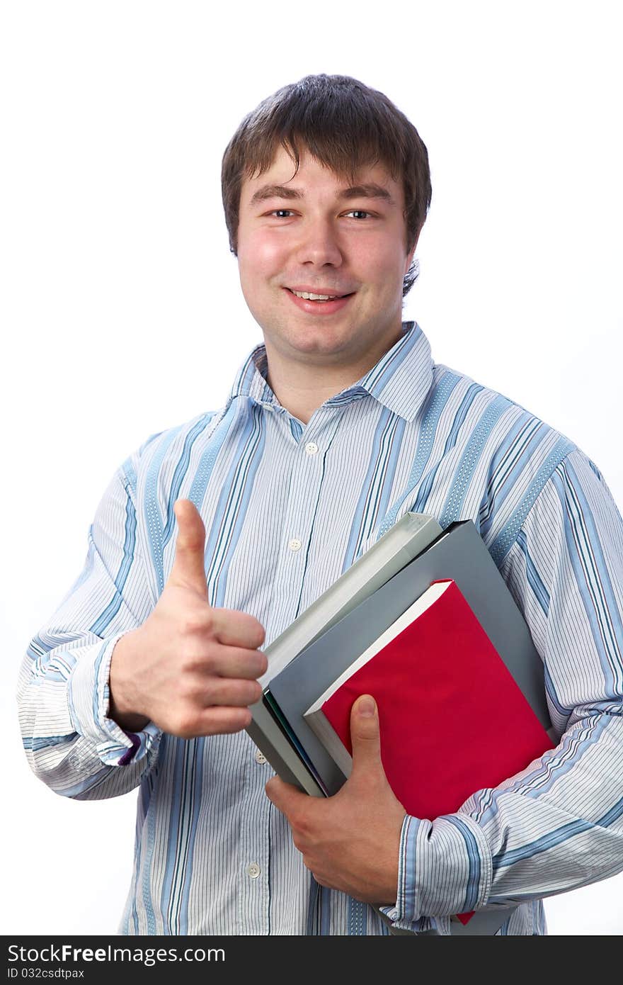 Student with books in the hands of smiles and shows gesture ok