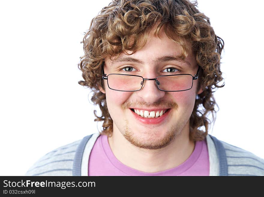 Portrait of a handsome young man in glasses with curly hair. Portrait of a handsome young man in glasses with curly hair