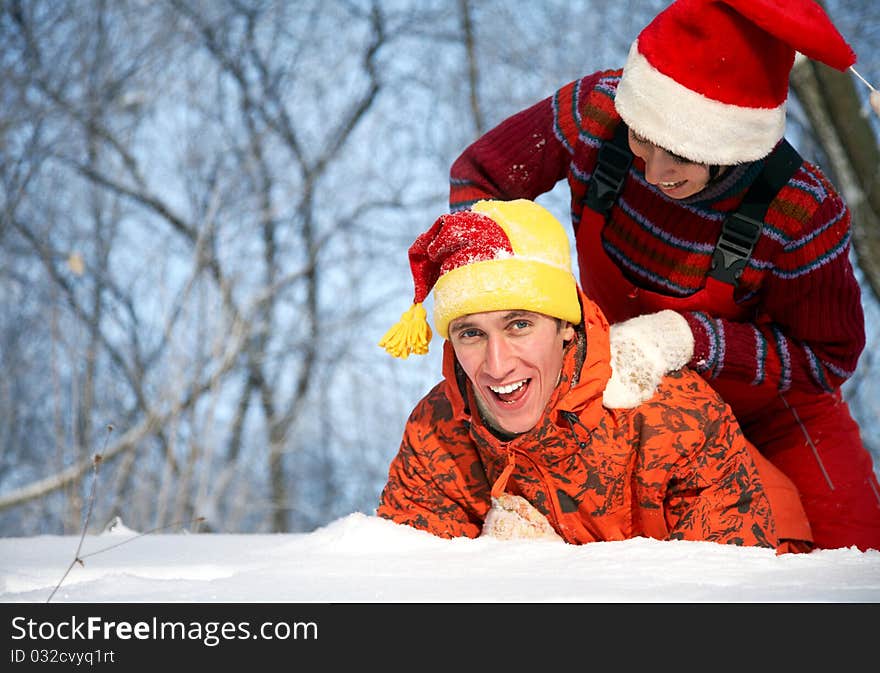 Young family plays winter wood on snow. Young family plays winter wood on snow